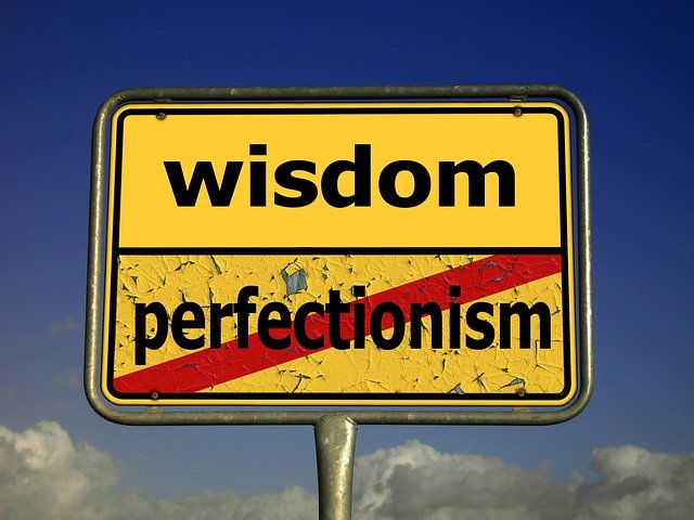 Sign that shows wisdom is better than perfectionism